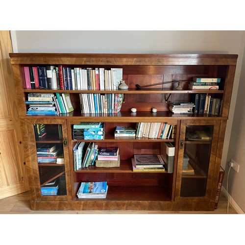 80 - A mahogany bookcase with shelves and two cupboards. Approximately 193cm l x 160cm h  x 30cm d.