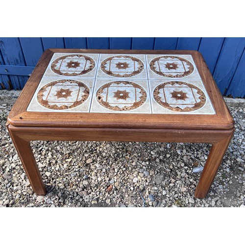 81 - A mid 20thC teak tiled top coffee table 71cm x 51cm x 41cm h.