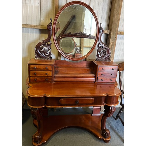 82 - A 19thC mahogany duchess dressing table with three drawers to the top at each side and a well in bet... 