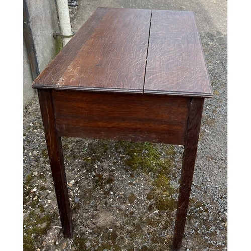 84 - An early 19thC three drawer oak lowboy with drop brass handles. 75cm w x 45cm d x 65cm h.