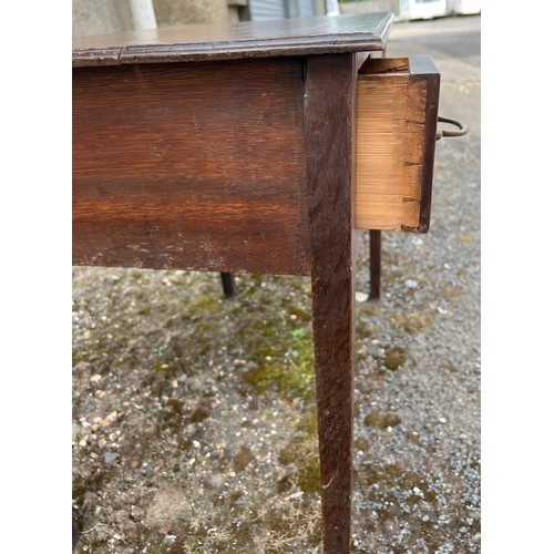 84 - An early 19thC three drawer oak lowboy with drop brass handles. 75cm w x 45cm d x 65cm h.