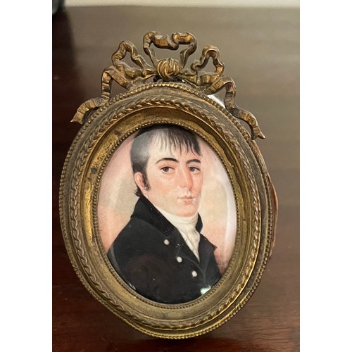 1261 - Dunthorne Pinxt 1803. A 19thC English school of a gentleman with black hair and blue jacket on ivory... 