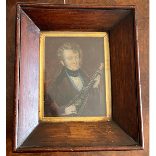 1263 - An early 19thC miniature of a gentleman playing the mandolin on ivory in original rosewood frame. s ... 