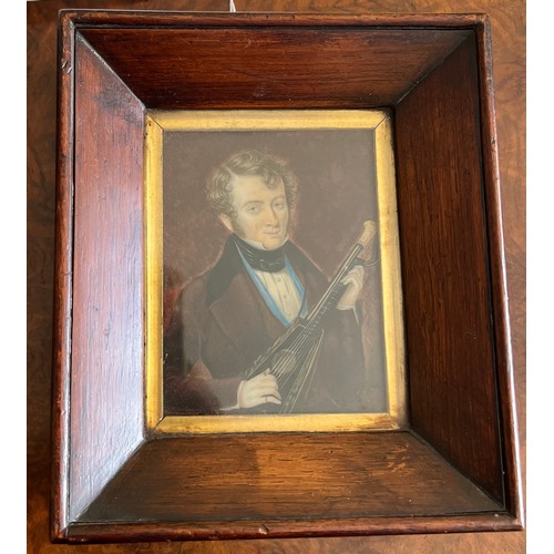 1263 - An early 19thC miniature of a gentleman playing the mandolin on ivory in original rosewood frame. s ... 