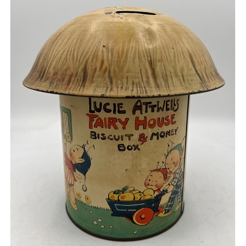 1257 - A William Crawford & Sons Ltd Lucie Attwell’s Fairy House Biscuit 19cm h and Money Box together with... 