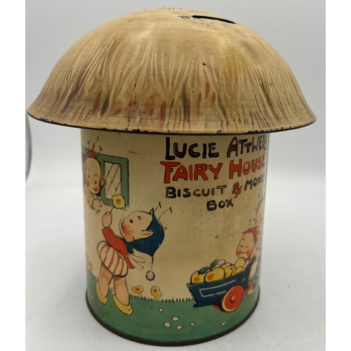 1257 - A William Crawford & Sons Ltd Lucie Attwell’s Fairy House Biscuit 19cm h and Money Box together with... 