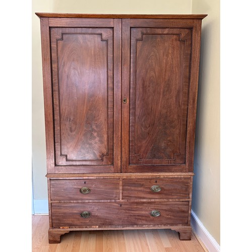 92 - An early 19thC linen press. 2 doors over 3 drawers. 122 w x 42 d x 186cm h.