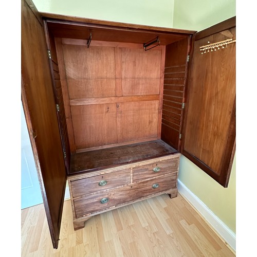 92 - An early 19thC linen press. 2 doors over 3 drawers. 122 w x 42 d x 186cm h.