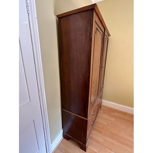 92 - An early 19thC linen press. 2 doors over 3 drawers. 122 w x 42 d x 186cm h.