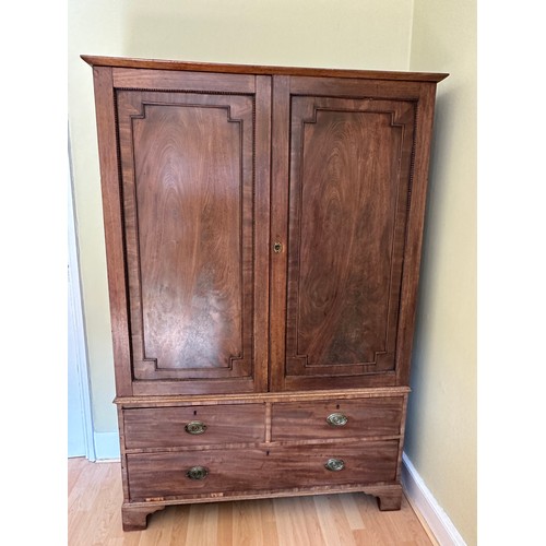 92 - An early 19thC linen press. 2 doors over 3 drawers. 122 w x 42 d x 186cm h.