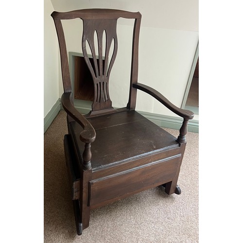 94 - A late 18thC elm nursing chair with rockers and drawer to one side. 89cm h.