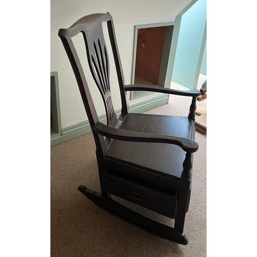 94 - A late 18thC elm nursing chair with rockers and drawer to one side. 89cm h.