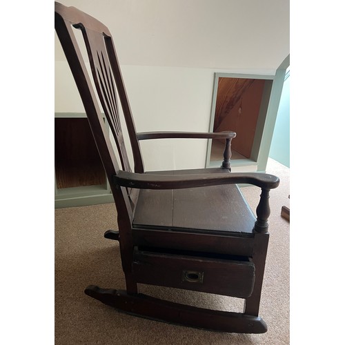 94 - A late 18thC elm nursing chair with rockers and drawer to one side. 89cm h.