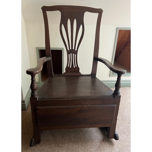 94 - A late 18thC elm nursing chair with rockers and drawer to one side. 89cm h.