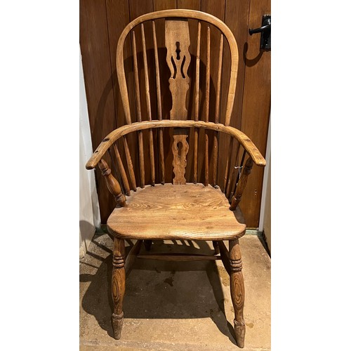 95 - A 19thC high backed Windsor chair in ash and elm.