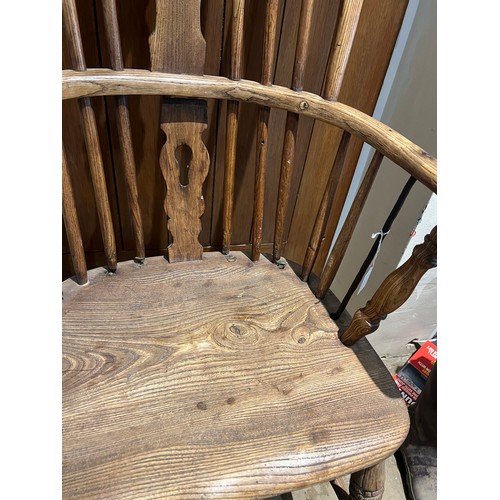 95 - A 19thC high backed Windsor chair in ash and elm.