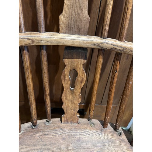 95 - A 19thC high backed Windsor chair in ash and elm.