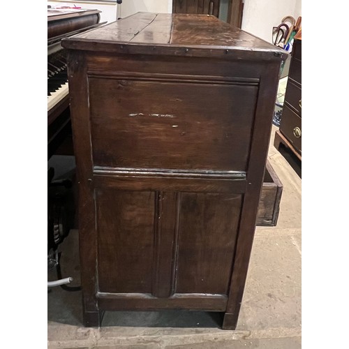 100 - An oak blanket box above four drawers with carved panels. IW 1703 carved into the top. New hinges to... 