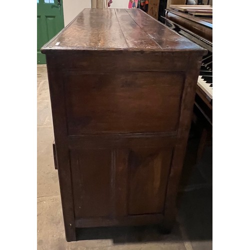 100 - An oak blanket box above four drawers with carved panels. IW 1703 carved into the top. New hinges to... 