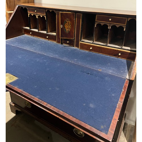 101 - A 19thC mahogany fall front bureau with well fitted interior. Four graduating drawers with ivory esc... 