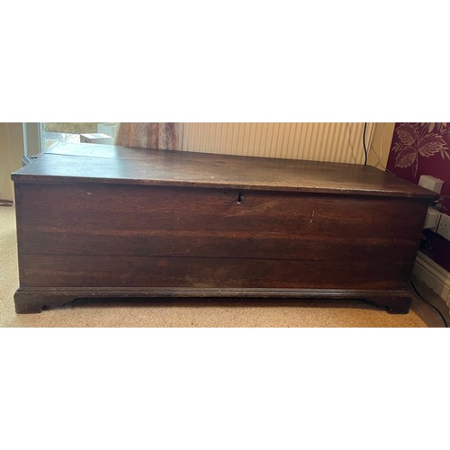 103 - A 19thC oak chest with candle box. 129cm w x 42cm d x 43cm h.