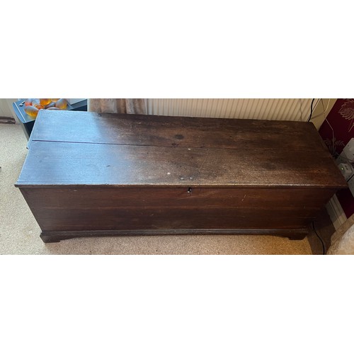 103 - A 19thC oak chest with candle box. 129cm w x 42cm d x 43cm h.