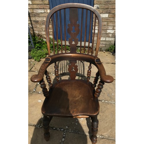 47 - A 19thC broad armed Windsor chair with double H stretcher measuring approx 116cm h floor to top of c... 