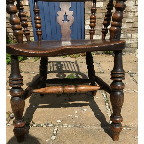 47 - A 19thC broad armed Windsor chair with double H stretcher measuring approx 116cm h floor to top of c... 