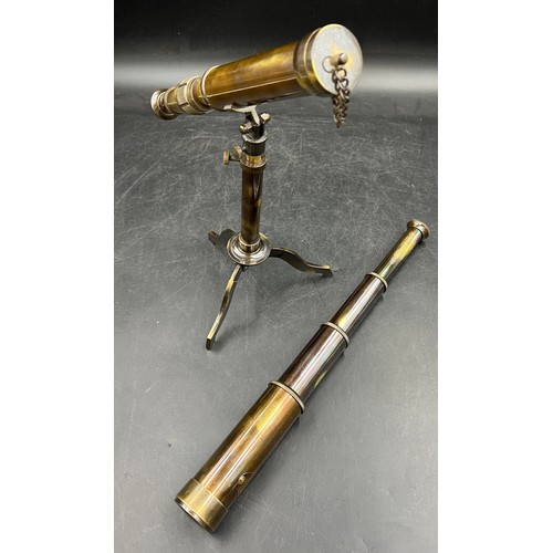 20A - Two replica brass telescopes, a pedestal desk top telescope and a four drawer naval telescope both i... 