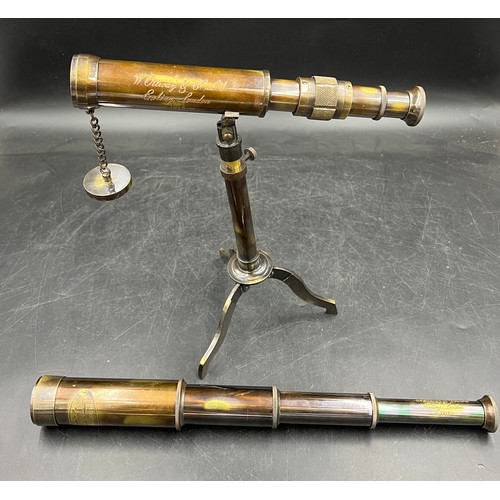 20A - Two replica brass telescopes, a pedestal desk top telescope and a four drawer naval telescope both i... 