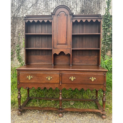 30A - An early 20thC solid oak high back dresser in the Georgian style. Two drawers to the base, the back ... 