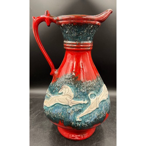 45C - A Mid 20thC West German large ceramic jug by Walter Gerhards depicting a mounted hunter with bow in ... 