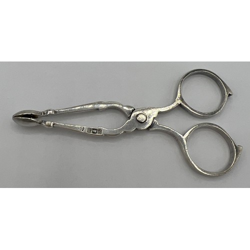 70A - A pair of hallmarked silver sugar nips of diminutive proportions, 8cms long. Sheffield 1902 maker Ja... 