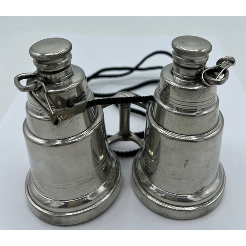 95A - A novelty pewter hip flask modelled as a pair of binoculars, each eye piece unscrewing to form two f... 