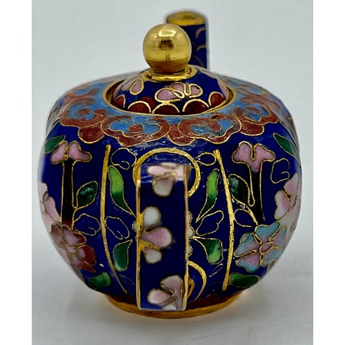 95B - A miniature cloisonn� teapot with floral decoration on blue ground. 5cm h x 8cm w.