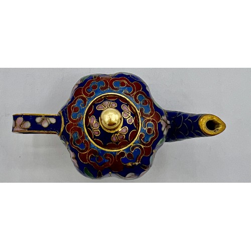 95B - A miniature cloisonn� teapot with floral decoration on blue ground. 5cm h x 8cm w.