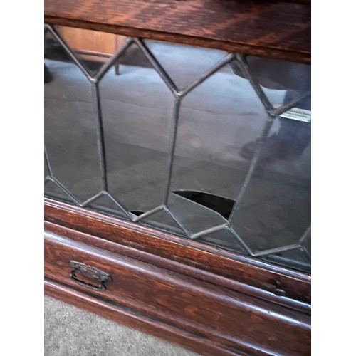 10A - A dark oak 4 height globe Wernicke and co ltd bookcase with leaded glass fronts and drawer to base 8... 