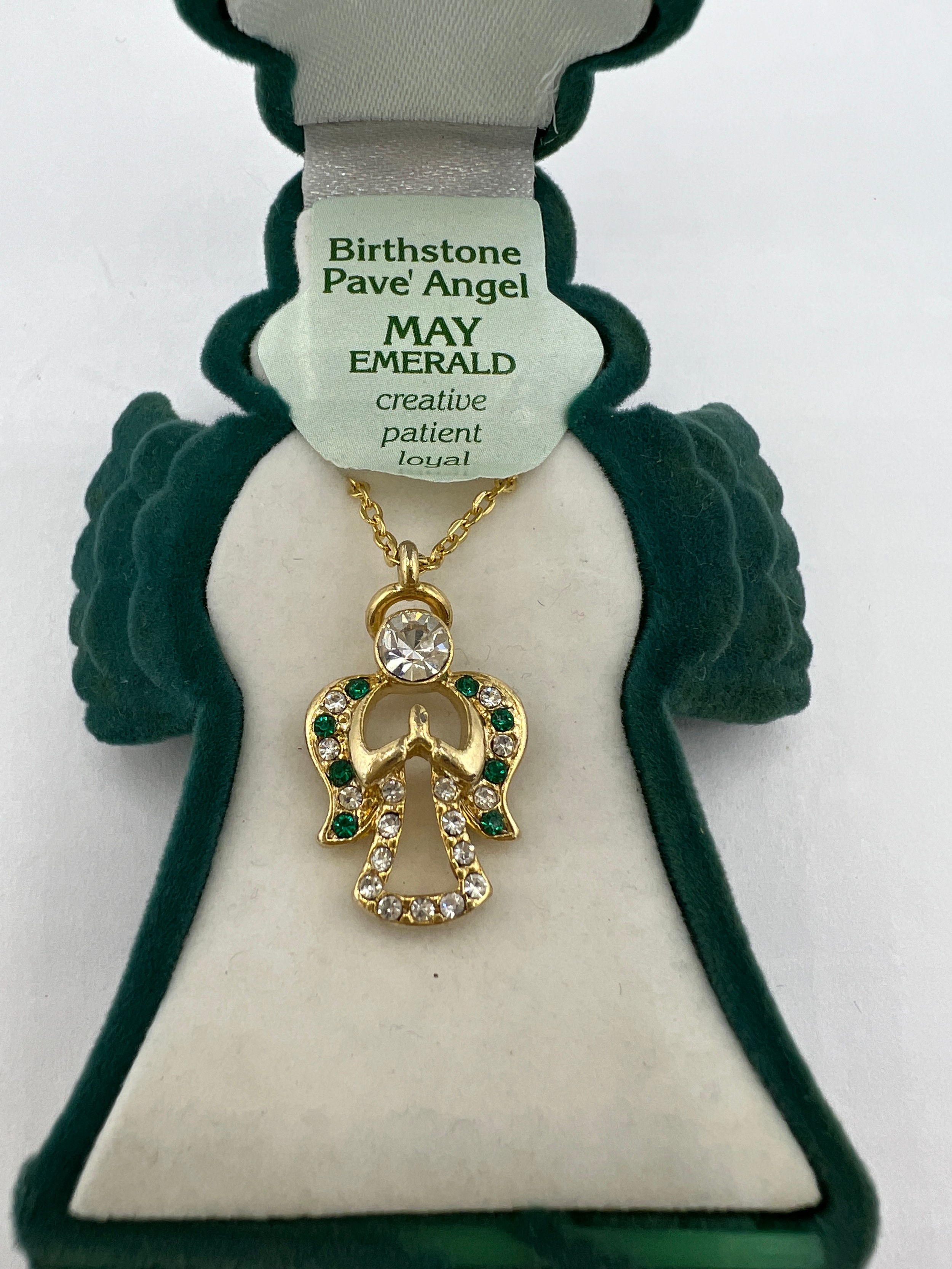 A contemporary Birthstone Pave Angel pendant necklace. The