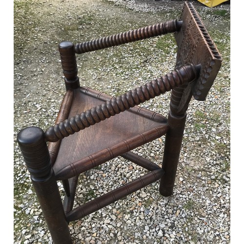 6A - Oak carved back Turners chair, bubble turned arms, circular legs. Height to seat 47cm, height to bac... 