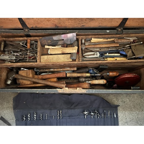 1327 - A vintage pine toolbox full of tools. 95cm w x 37cm d x 38cm h.