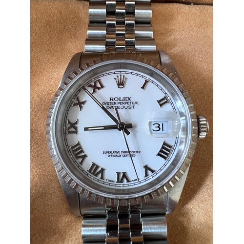 Rolex Oyster Perpetual Datejust wristwatch.
Reference: 16220, Serial: X502599. Date: Circa 1991, case 36mm.
Movement: Automatic.  White dial, Roman numeral hour markers, black outer minute track with luminous dot 5 minute markers, magnified date aperture at 3, polished faceted baton hands with luminous inserts.
Case: Brushed and polished tonneau form, screw down back and crown, fluted bezel, bracelet stamped 555B.

Box and papers, guarantee and original purchase receipt.  Spare links.

In excellent working condition. Box and papers and original purchase receipt.