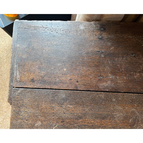 43 - A 19thC oak chest with candle box. 129cm w x 42cm d x 43cm h.