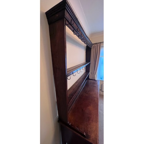 1 - An 18thC oak dresser and rack with original iron hooks, 165 w x 195 h x 41cm d.