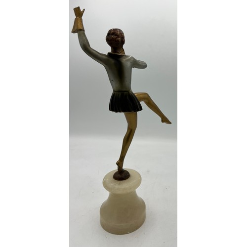 1328 - Art Deco figure of a dancing girl on onyx plinth. 31cm h.