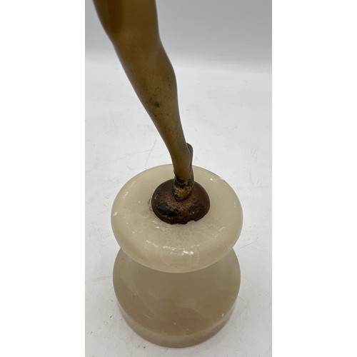 1328 - Art Deco figure of a dancing girl on onyx plinth. 31cm h.