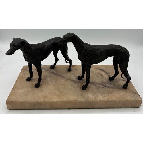 1329 - Unsigned bronze sculpture depicting two hound dogs on a marble base. 14cm h.