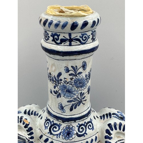 132 - A late 19th/early 20thC Dutch blue and white faience olive oil jar, 35cm h. together with a marble s... 