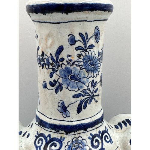 132 - A late 19th/early 20thC Dutch blue and white faience olive oil jar, 35cm h. together with a marble s... 