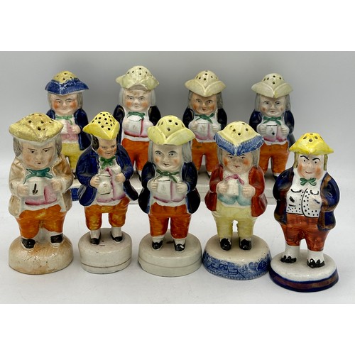 137 - An assortment of 19thC Staffordshire cruet figures, the majority holding jugs of ale. (19).