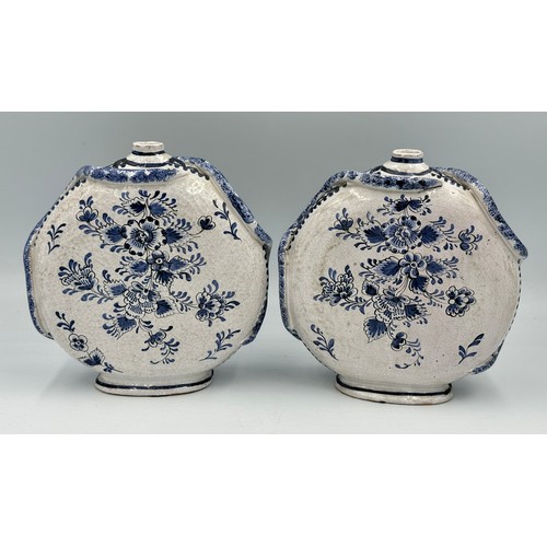 141 - A pair of 18thC Delft blue and white pottery moon flasks with applied coiled serpents to the side fi... 